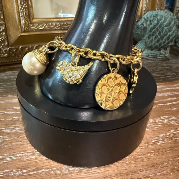 Coach Gold Tone Multi Charm Bracelet. Includes locket Heart, Bird, Star and more - Picture 16 of 17